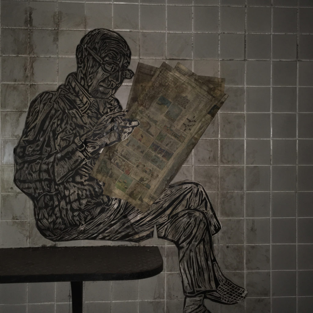 Dupont Underground - paper art man reading newspaper