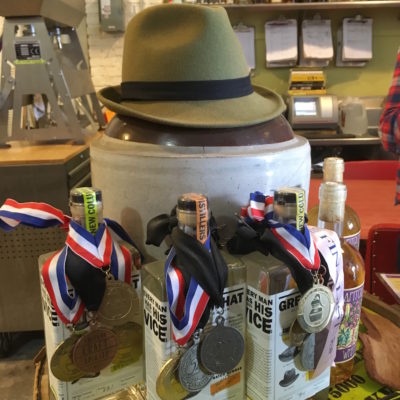 New Columbia Distillers - Awards and green fedora