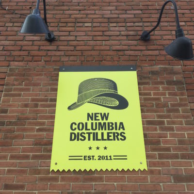 New Columbia Distillers - Logo and sign