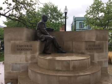 Statue of Carter G. Woodson outside the Woodson Home