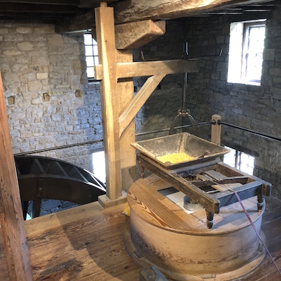 George Washington's Distillery and Gristmill - grinding grain using water wheel